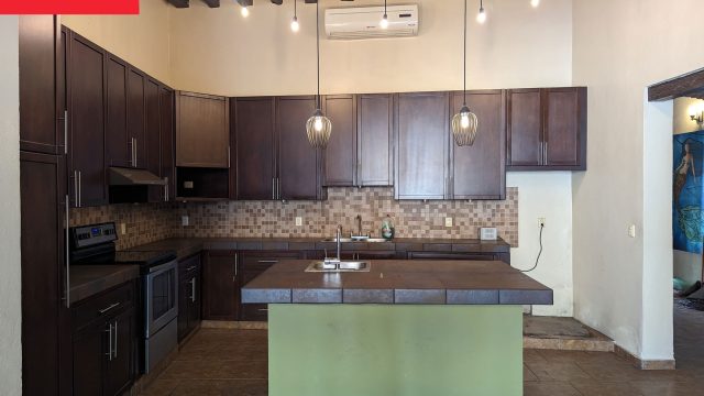 Transforming a Dreary Kitchen: The Impact of Dark Teal Cabinetry